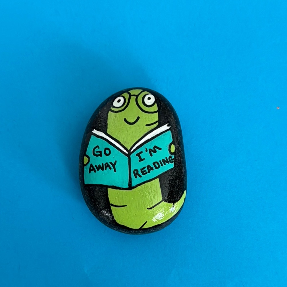 Hand Painted Rock with Reading Worm Design